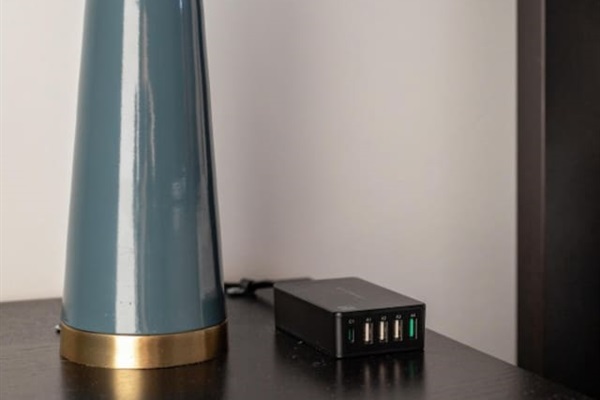 Sleek lamp with a multi-port USB charger.