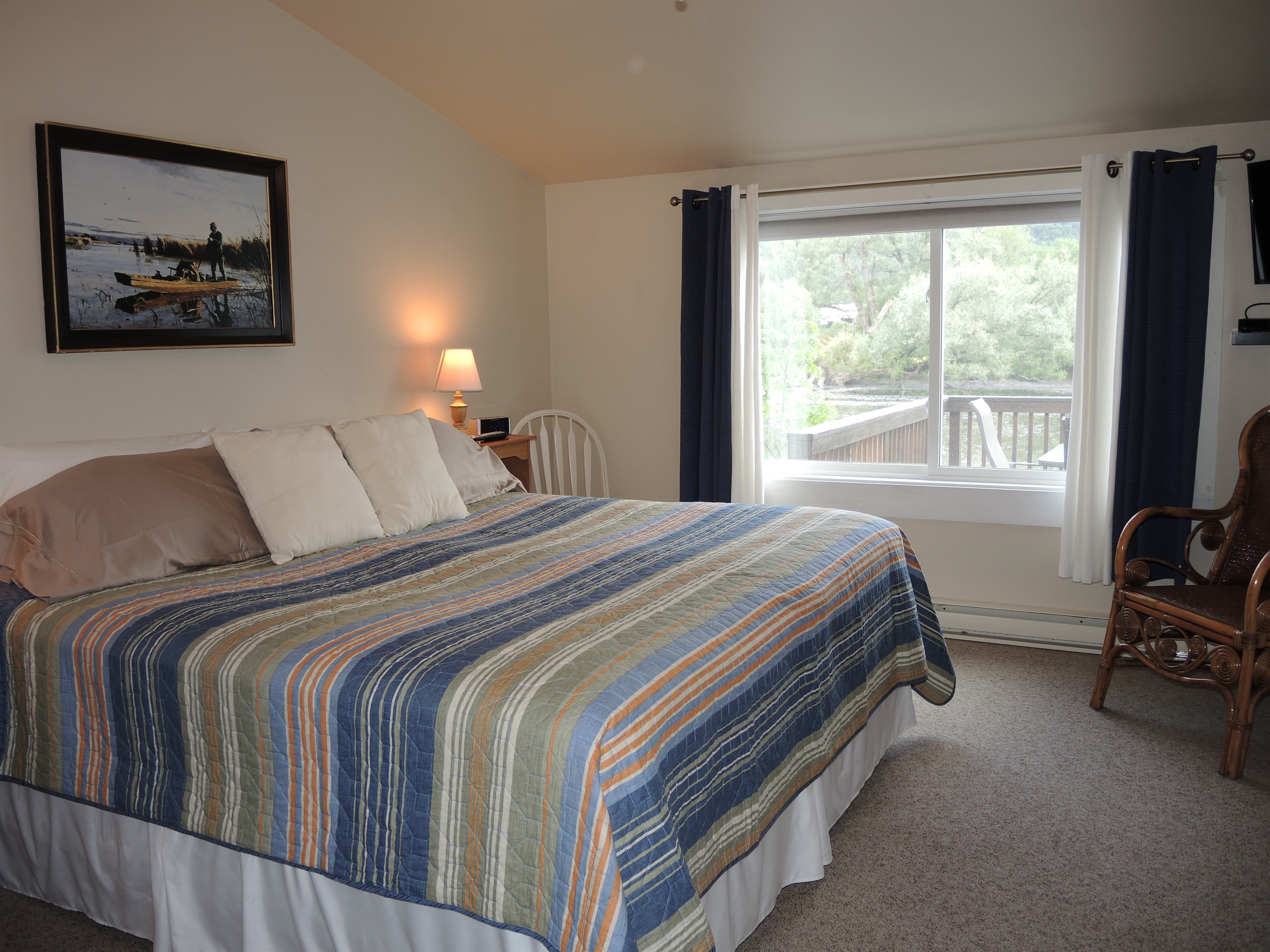 King bedroom with view of water