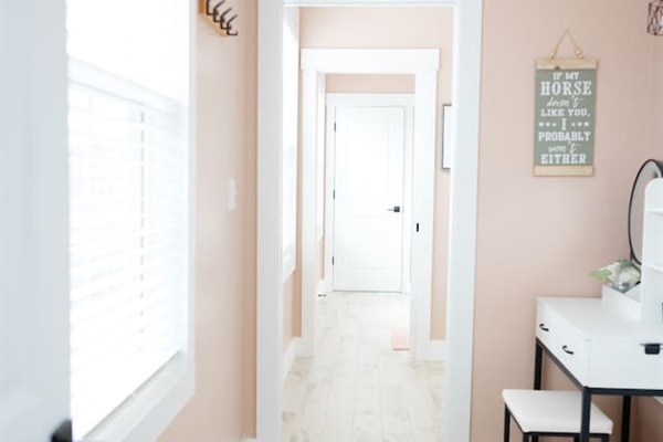 View looking from doorway of bedroom #5 through private sink/vanity area to bedroom #4's private sink/vanity area. Sliding doors for privacy in between with separate toilet and shower rooms.