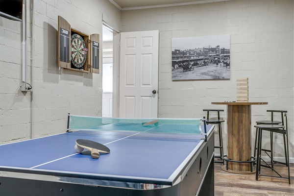 Casual fun with a full dart board setup and rustic game room vibes