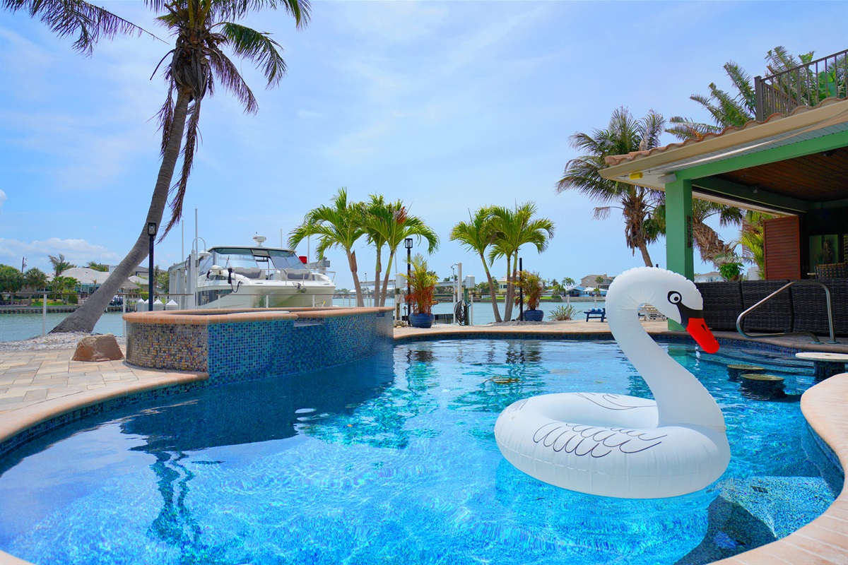 The large heated pool with spa has the feel of a luxury resort.