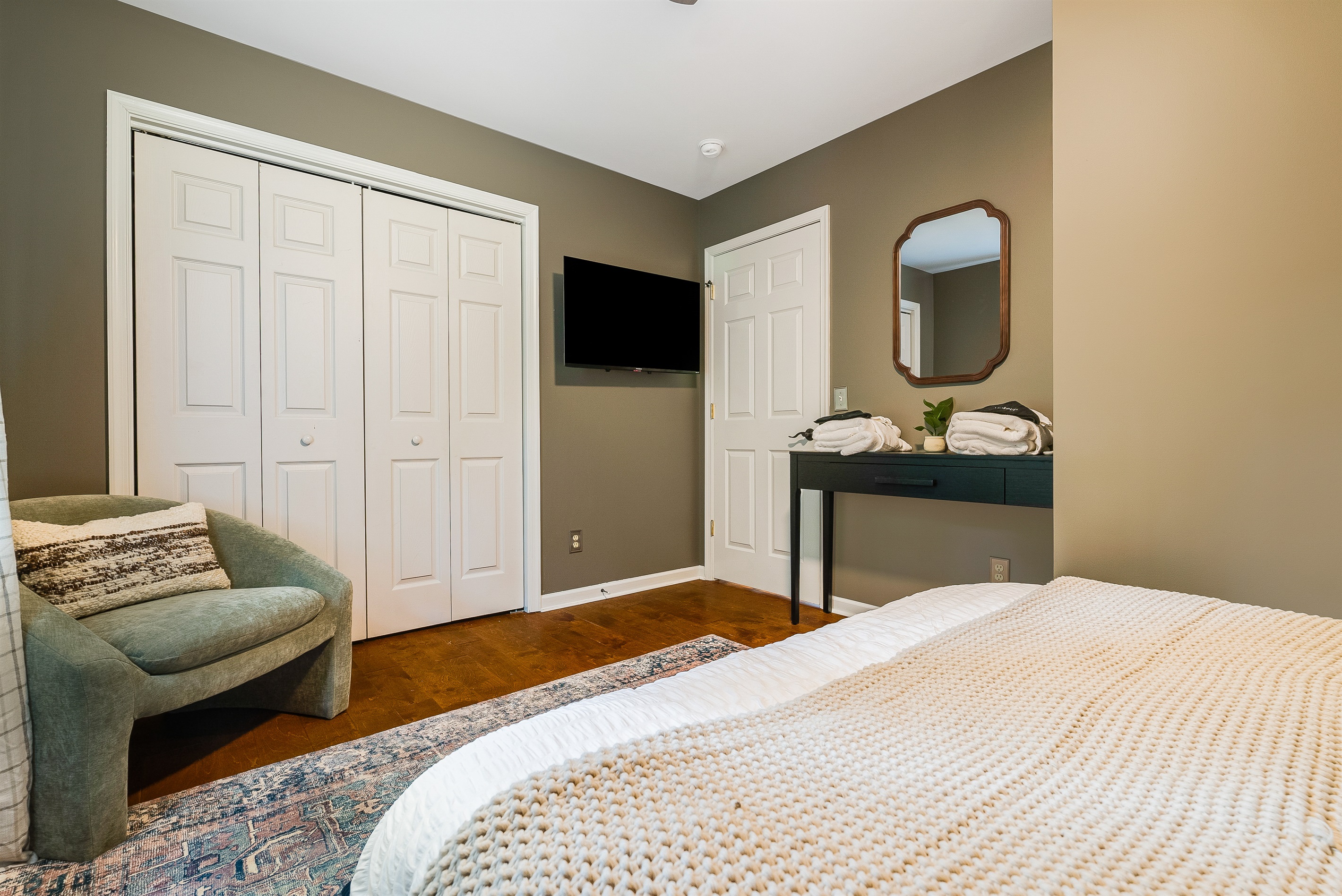 Queen bedroom offering both comfort and style
