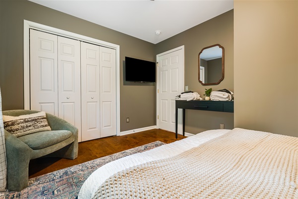 Queen bedroom offering both comfort and style