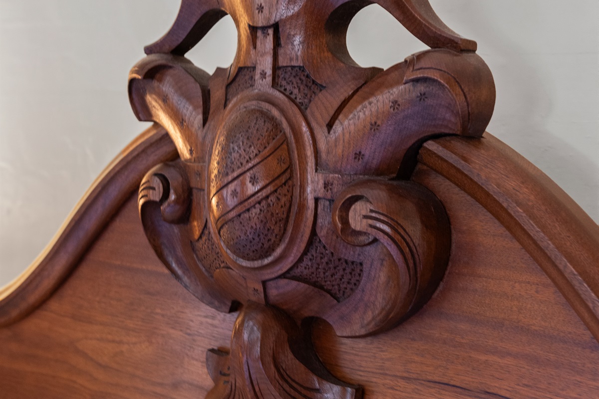 Intricate antique wood carving showcasing detailed craftsmanship