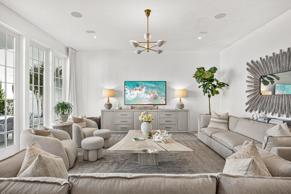 The stunning living room offers ample room for everyone to stretch out and relax.