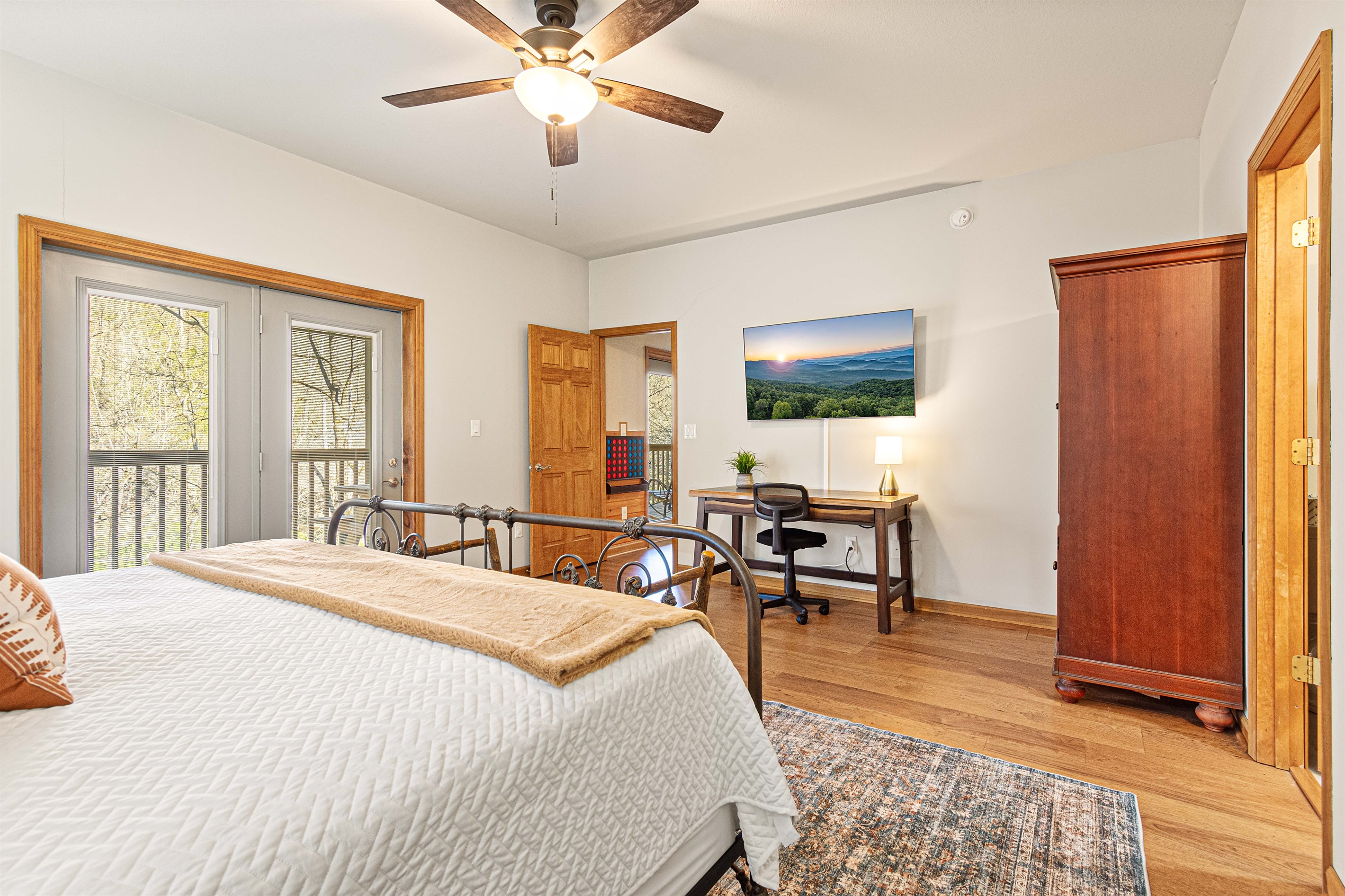 Another large King bedroom, work space, 55" smart TV, private bath, with access to the deck.
