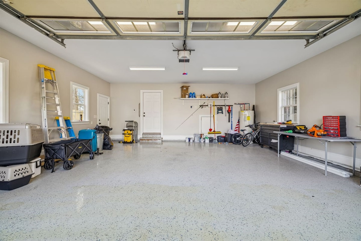 Garage has bikes, scooter, helmets, full set of tools, and storage.