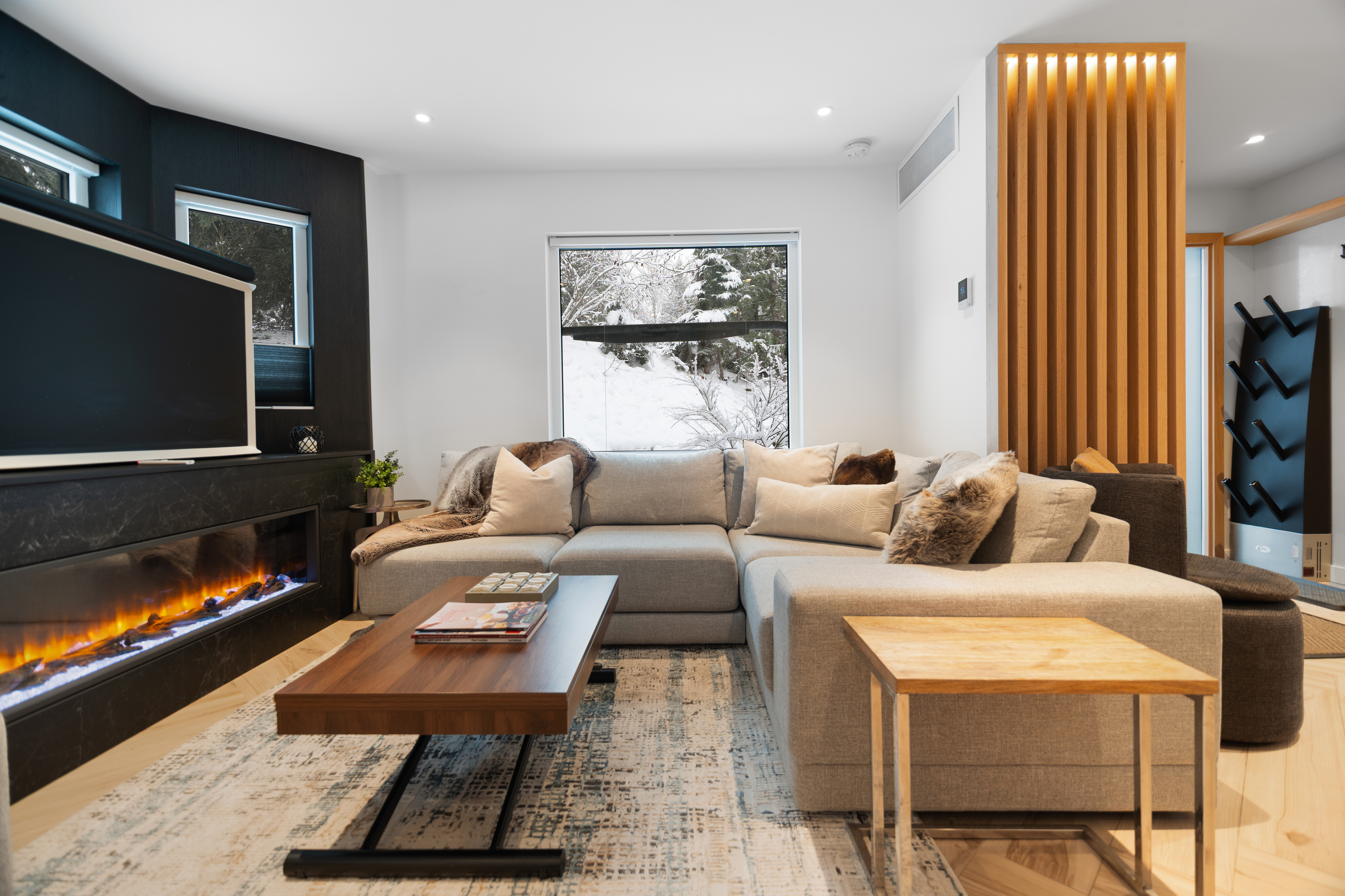 Sectional sofa facing the linear fireplace