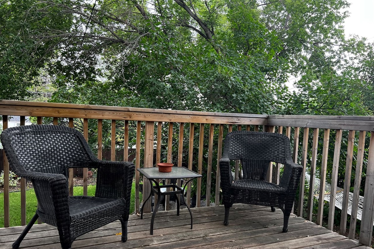 Two-seat deck setup for morning coffee or quiet evenings