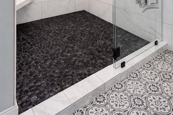 Walk-in shower with striking tile details and spa-inspired finishes.