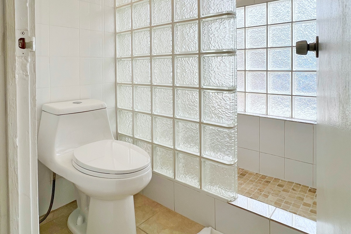 Clean lines and simple elegance make these bathrooms both functional and inviting.
