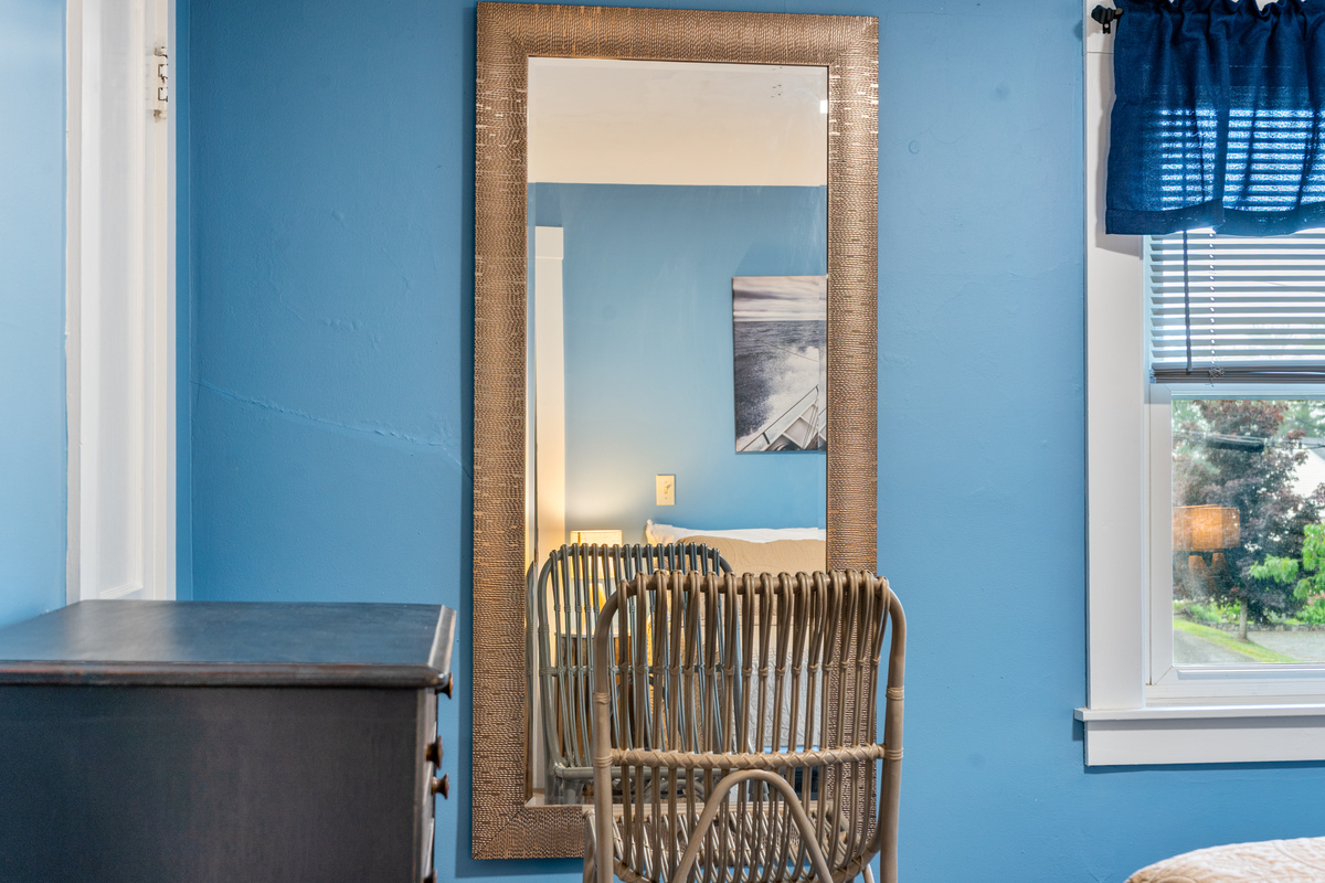 Take your time getting ready in front of the expansive full-length dressing mirror. The reflection of maritime art and the natural window light combine to keep you connected to the coastal energy of the home, even while unpacking or getting dressed.