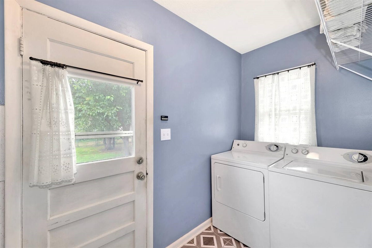 Separate Full Sized Laundry Room.