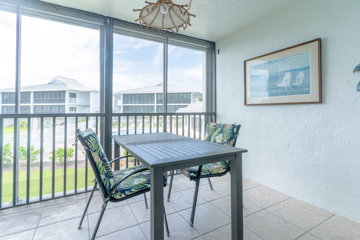 Screened in Lanai with views of gulf and pool.