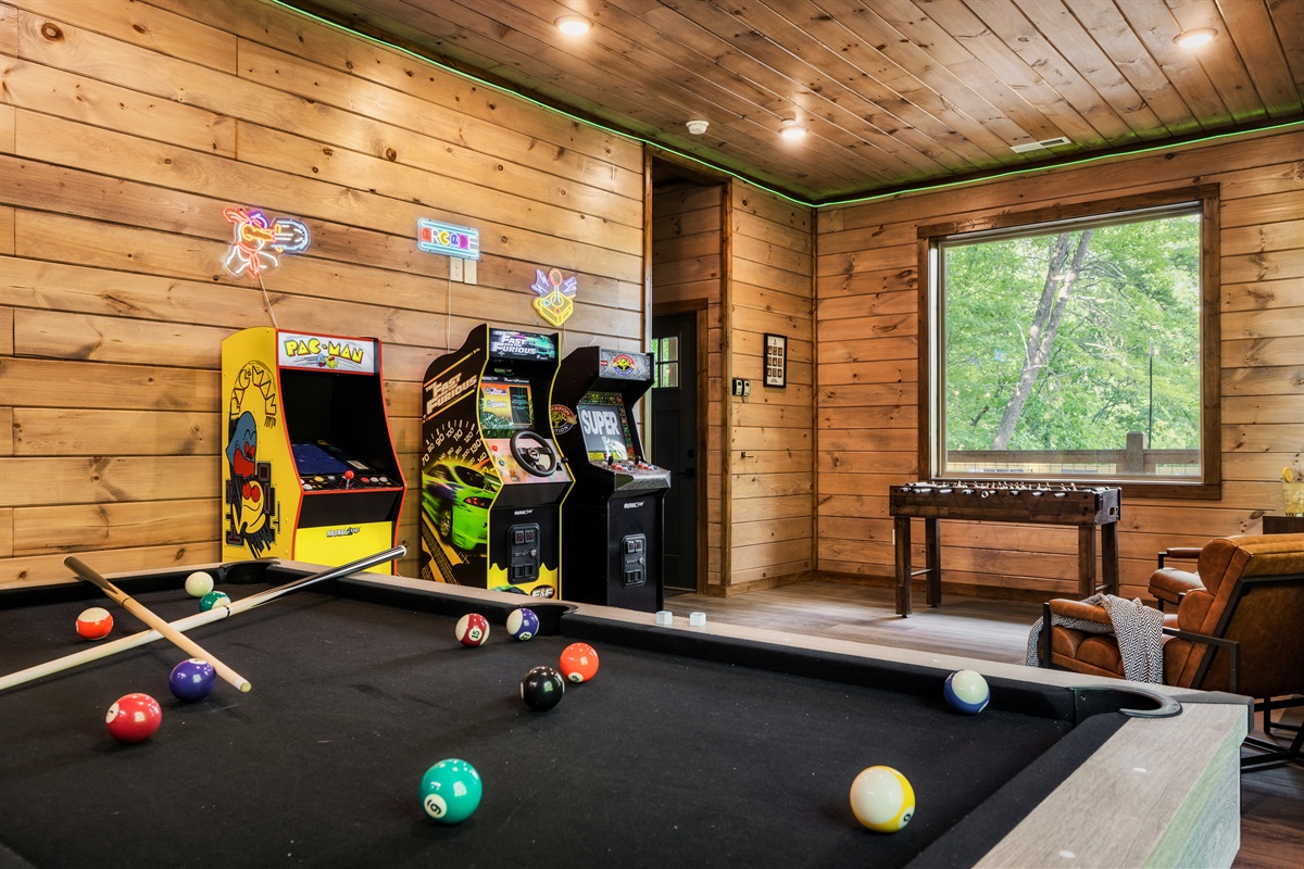 Game room with pool table, foosball table, arcades, board games, theater and half bath