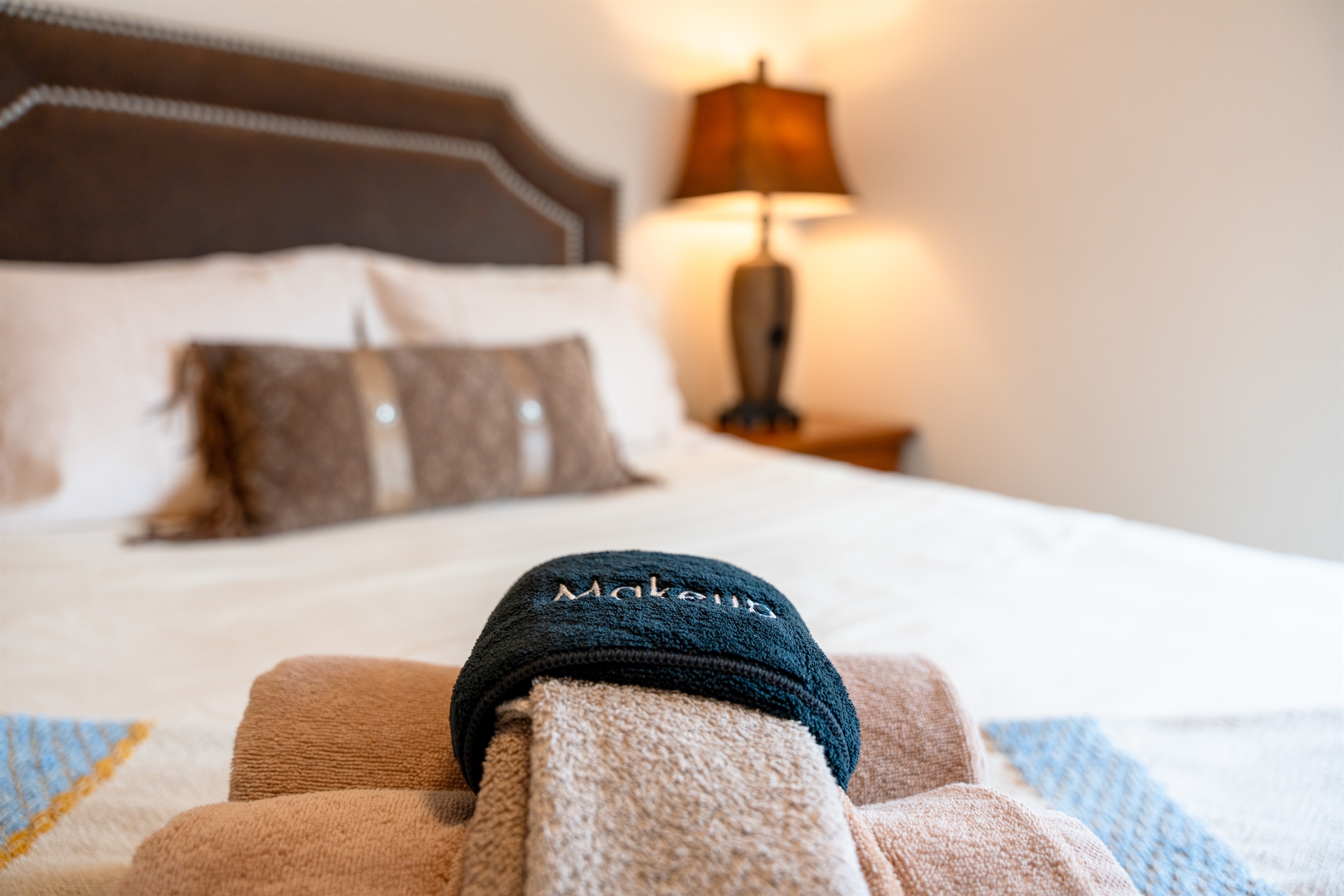 Close-up detail highlighting plush bedding and warm textures for a restful night’s sleep.