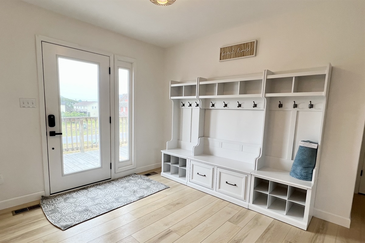 Beautiful entry way has plenty of storage place to stay organized on vacation!