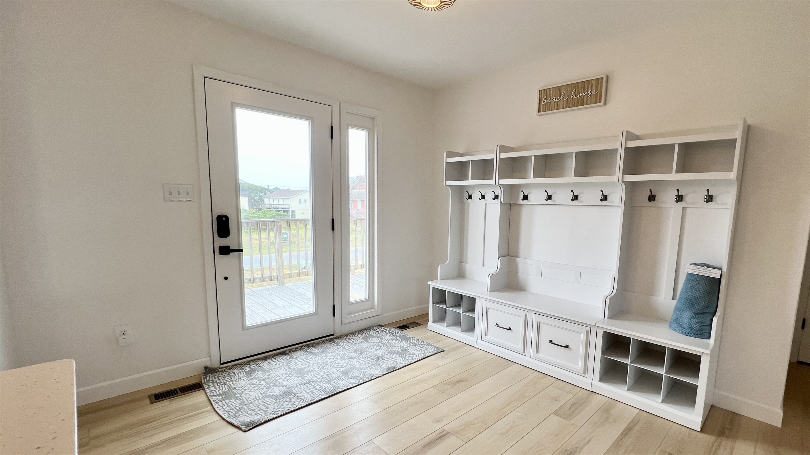Beautiful entry way has plenty of storage place to stay organized on vacation!