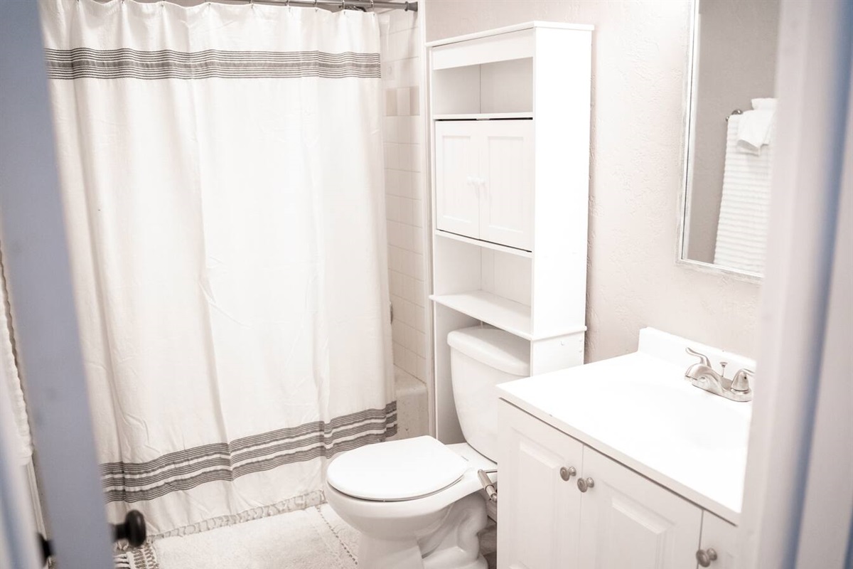 Enjoy the flexibility of a shower or bath in this full bathroom.