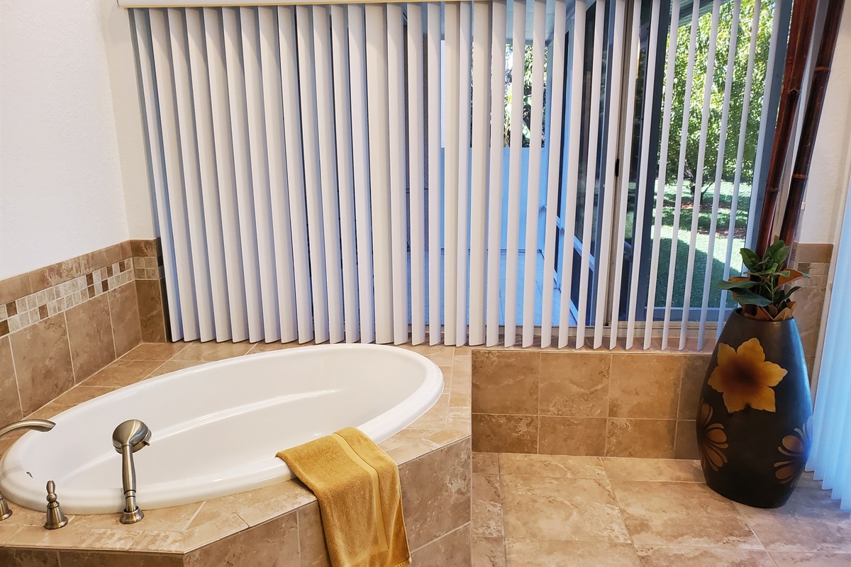 Sunk-in tub in private Master Queen bathroom