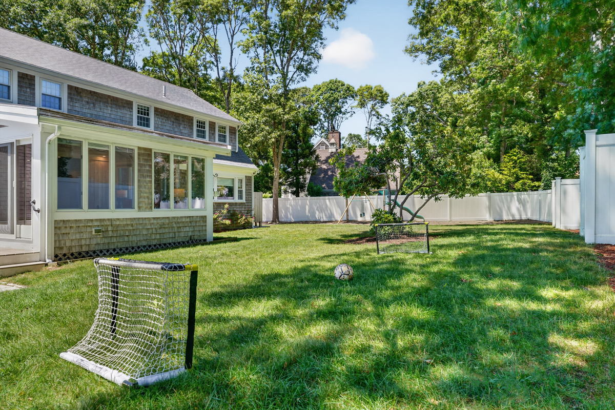 Expansive, fully fenced backyard with plenty of space for outdoor games and family fun.