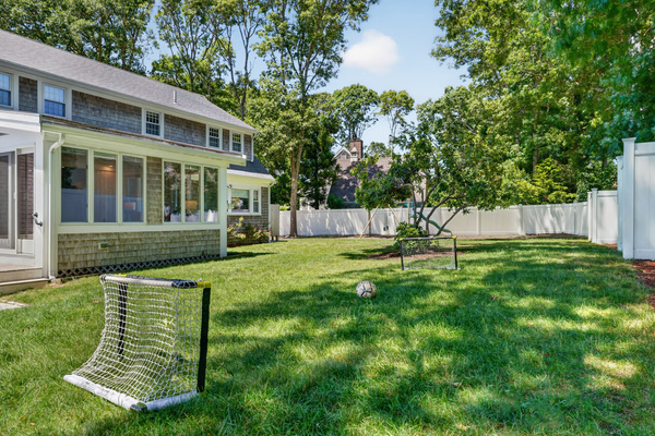 Expansive, fully fenced backyard with plenty of space for outdoor games and family fun.