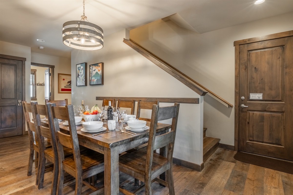 An adjoining door at the base of the stairs in the dining area connects seamlessly to the adjoining townhome when booked together — ideal for larger gatherings while preserving privacy when closed.