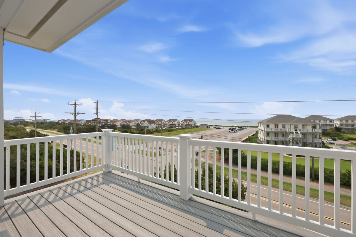 Private upper-level deck with beautiful coastal views, perfect for enjoying morning coffee or evening sunsets