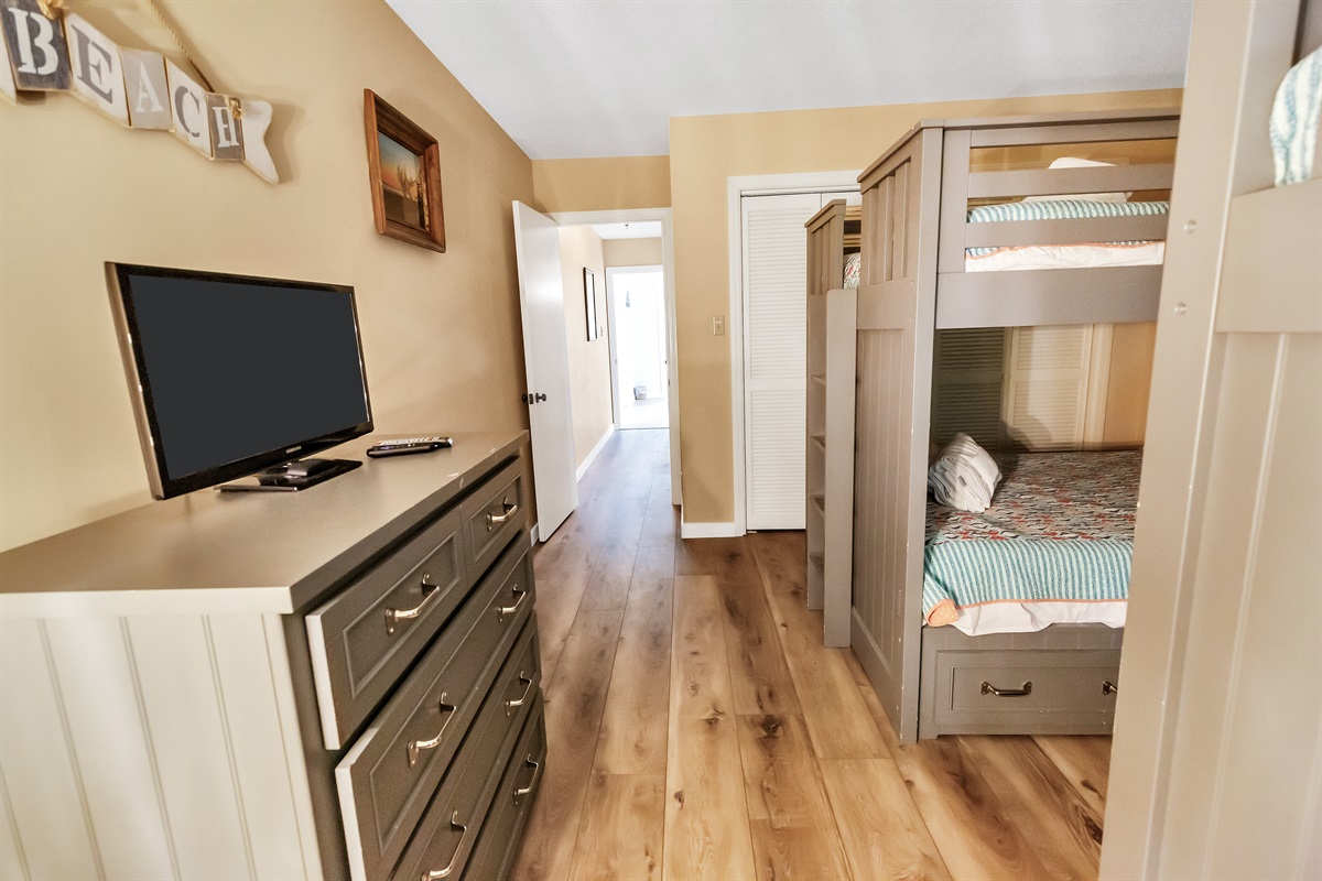 Bunk bedroom view into hallway & foyer