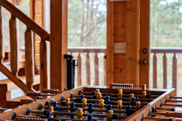 Full-size foosball table — the tournament starts the first night and the trash talk doesn't stop until checkout.