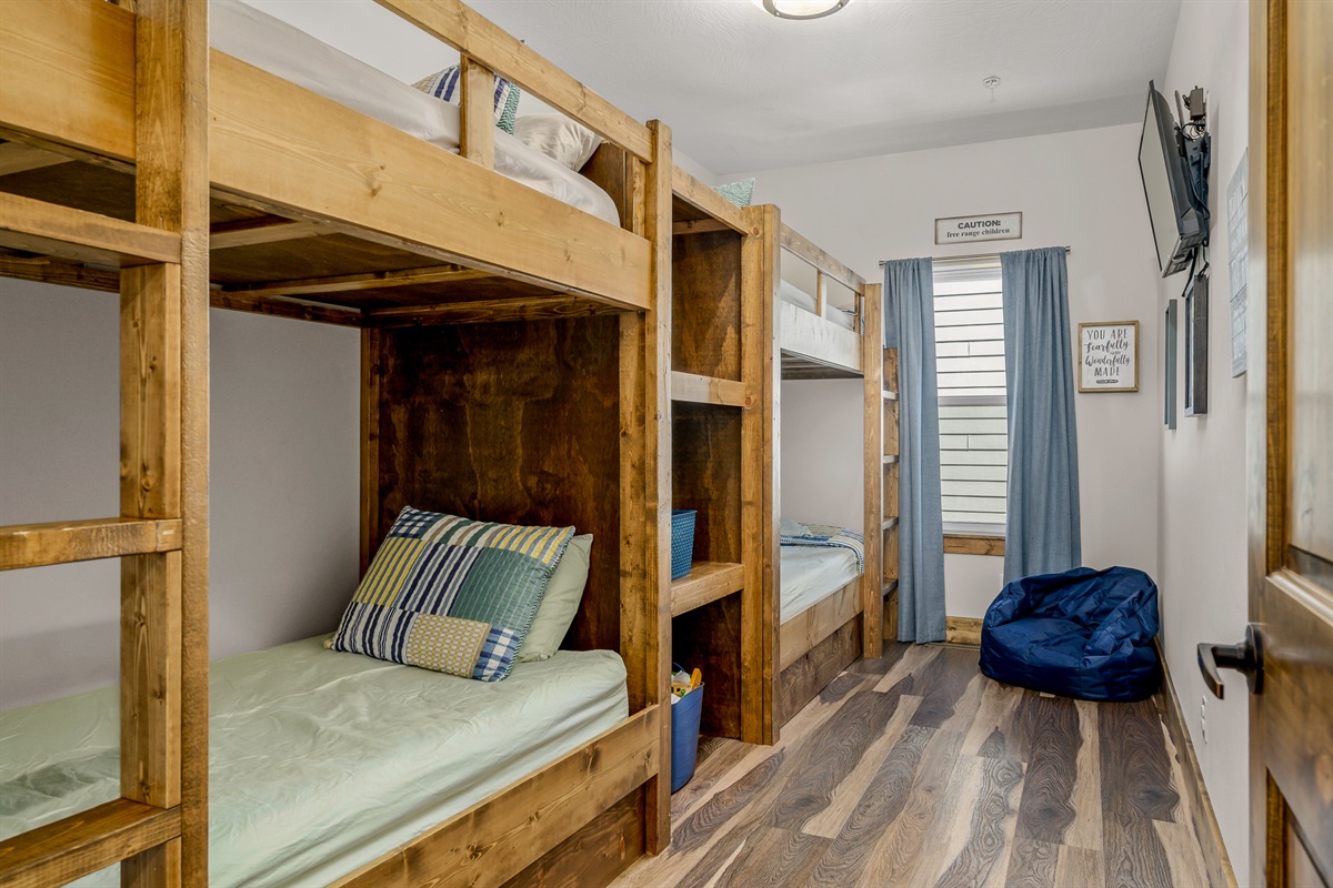 Main level: Minnie May bunkroom with 4 twins and 32" smart TV.