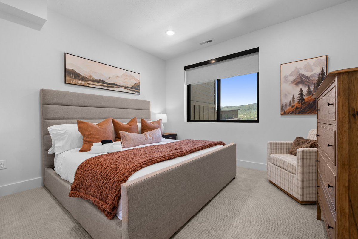 Spacious primary bedroom designed for comfort and relaxation.