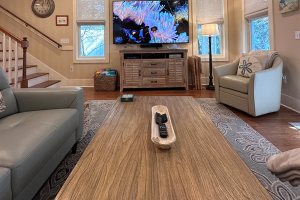 85 inch 4K UHD TV in Living Room; Bose soundbar. 