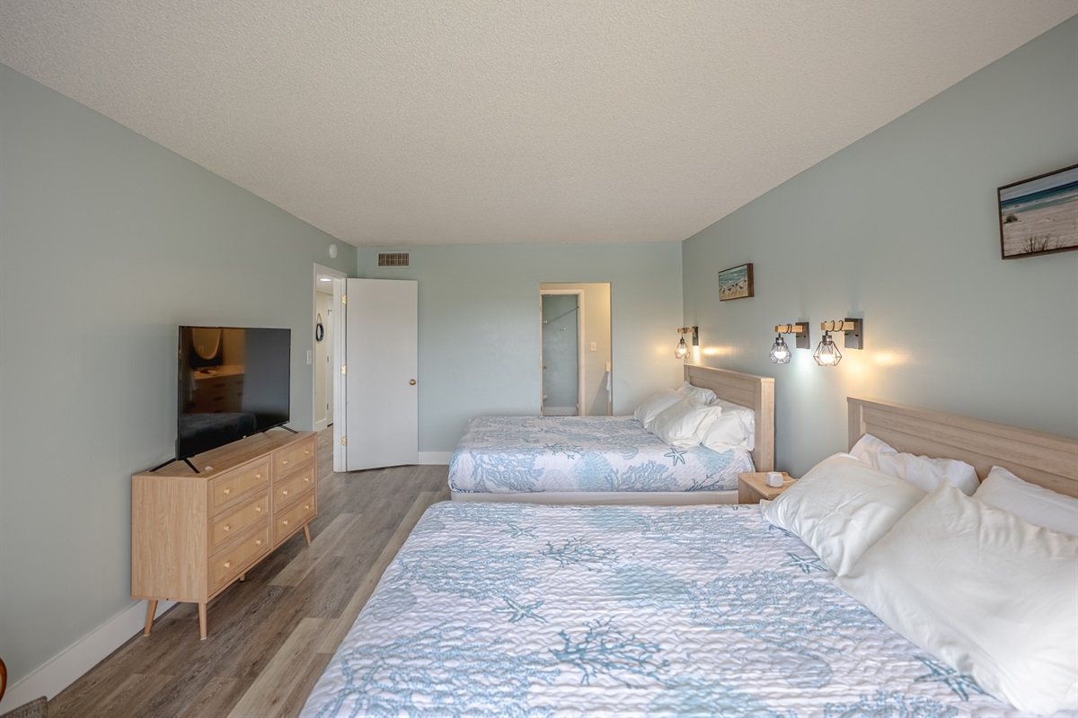 Bedroom with two queen beds, ensuite bathroom and smart TV