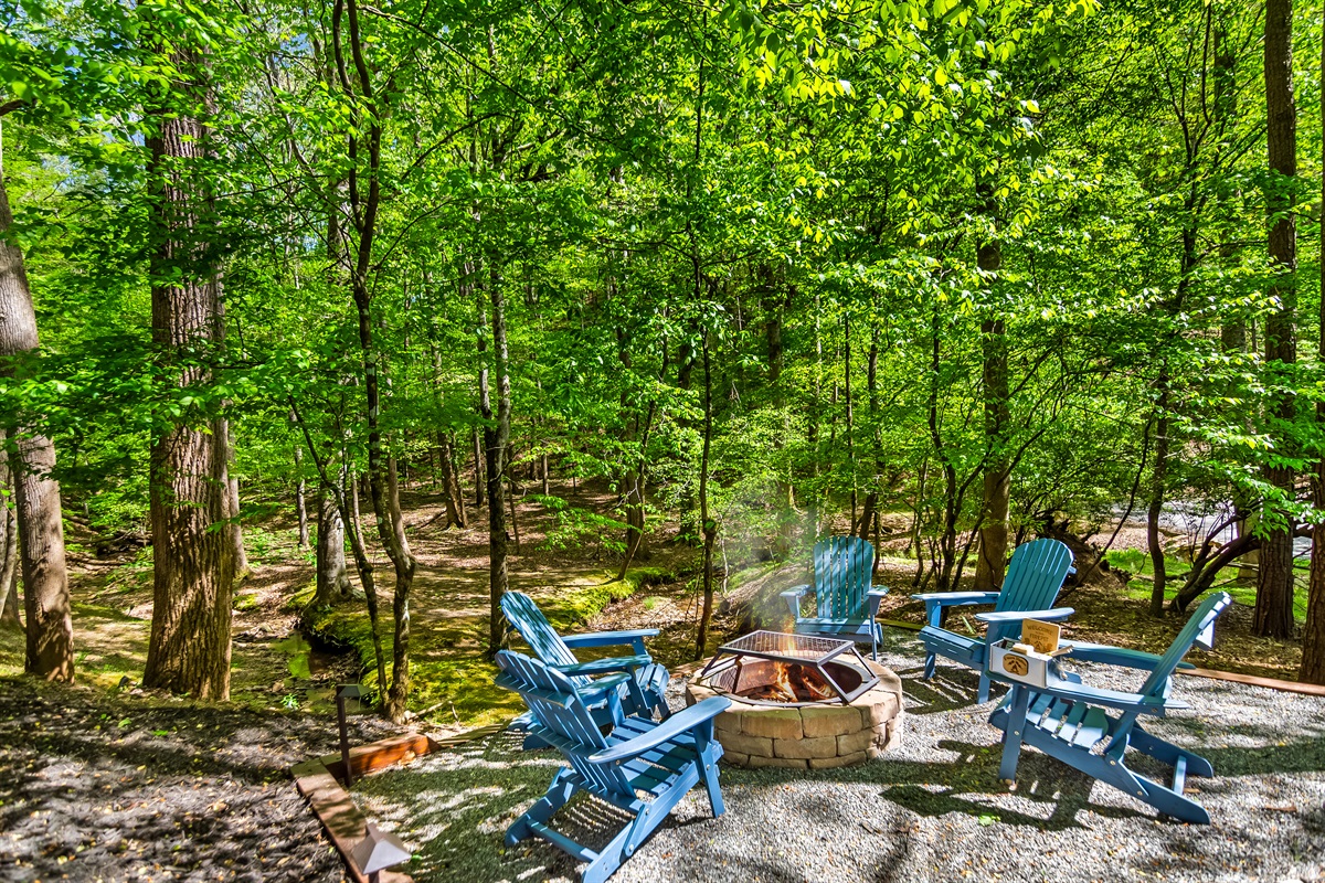 Cozy up to the fire pit with views of the Stream to soak in nature, sun, and rest!