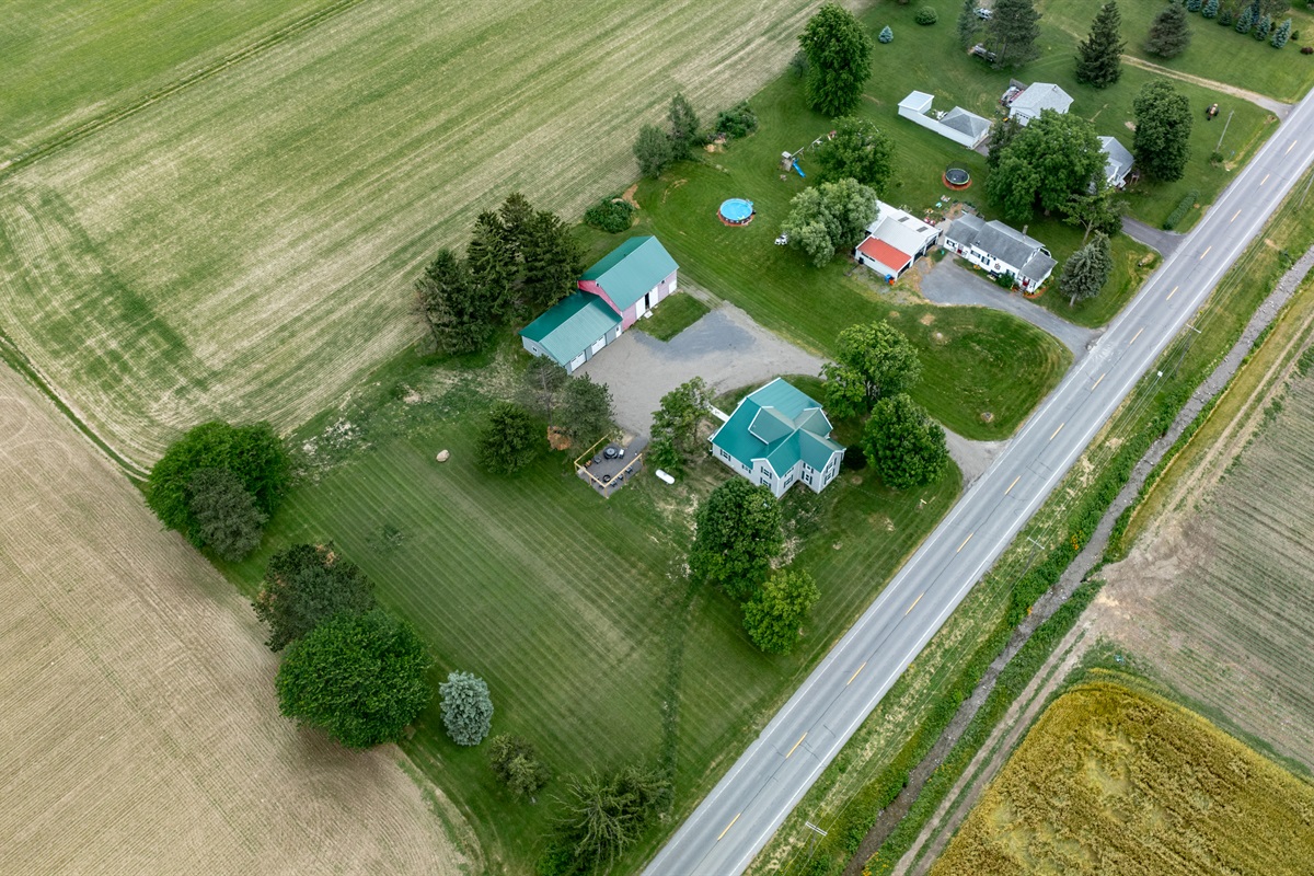 Peaceful country living with a charming home, spacious barn, and wide open green space—perfect for outdoor lovers and hobbyists alike.