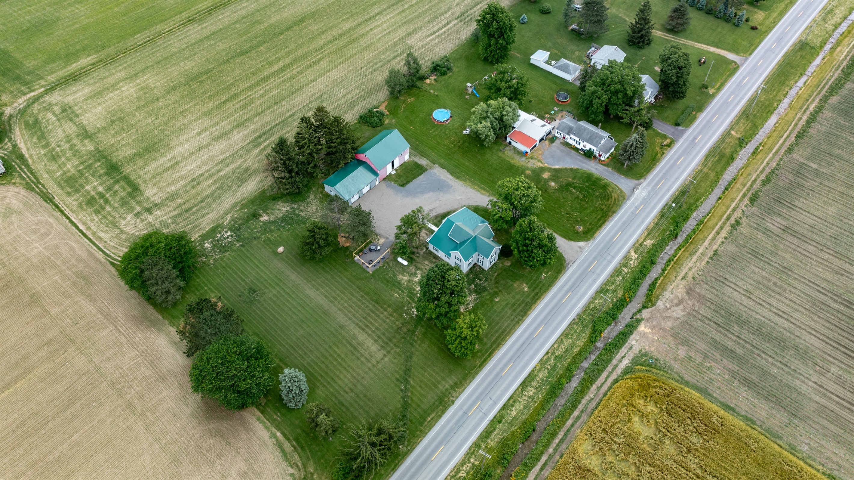 Peaceful country living with a charming home, spacious barn, and wide open green space—perfect for outdoor lovers and hobbyists alike.
