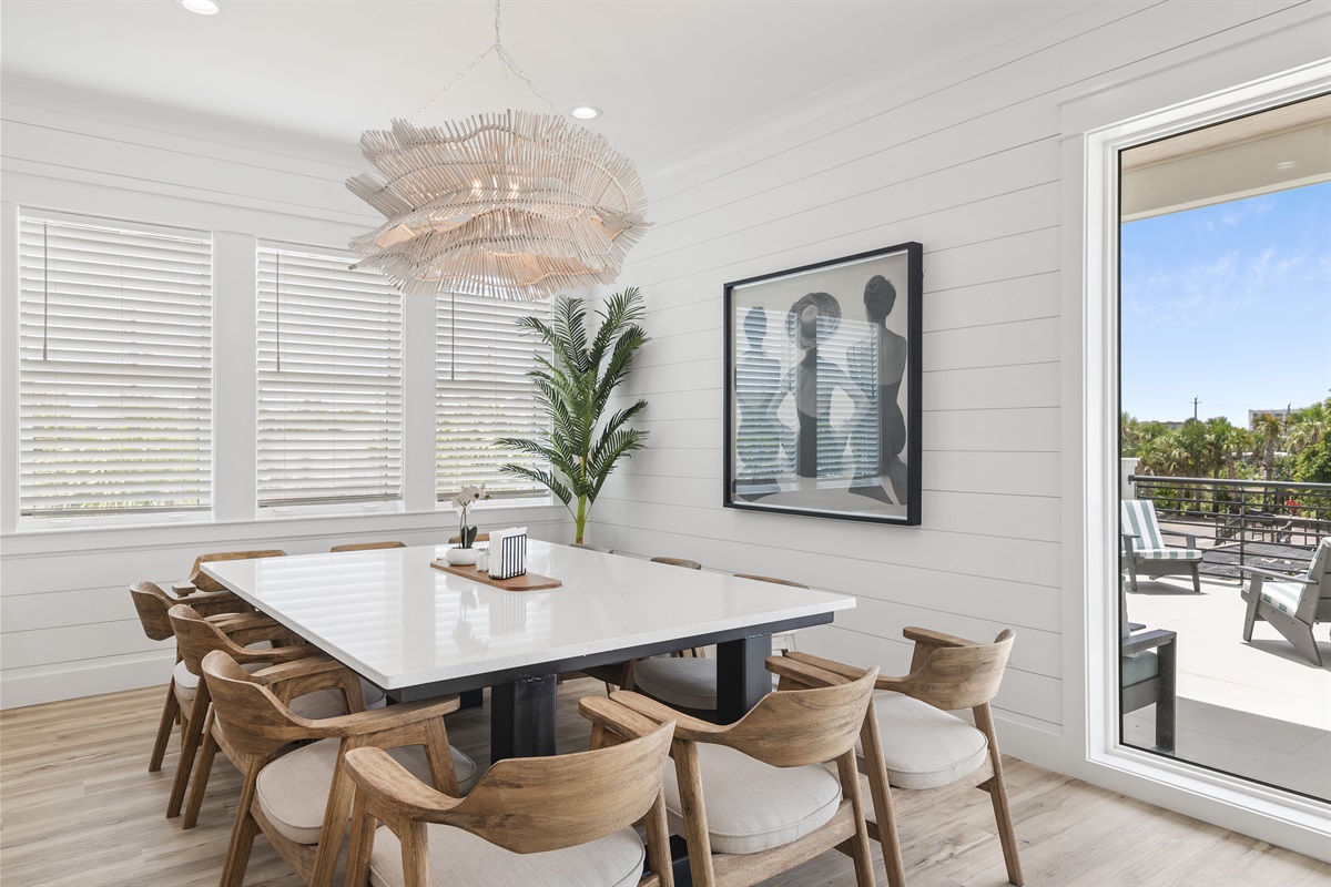 Enjoy a stylish dining space with modern art and beautiful lighting.
