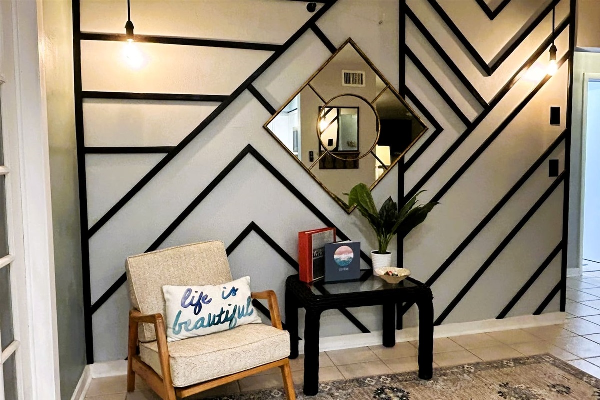 The Insta Wall/Reading Corner, where you will find informational books and guides all about the house, as well as local attractions, fishing, and beaches. 