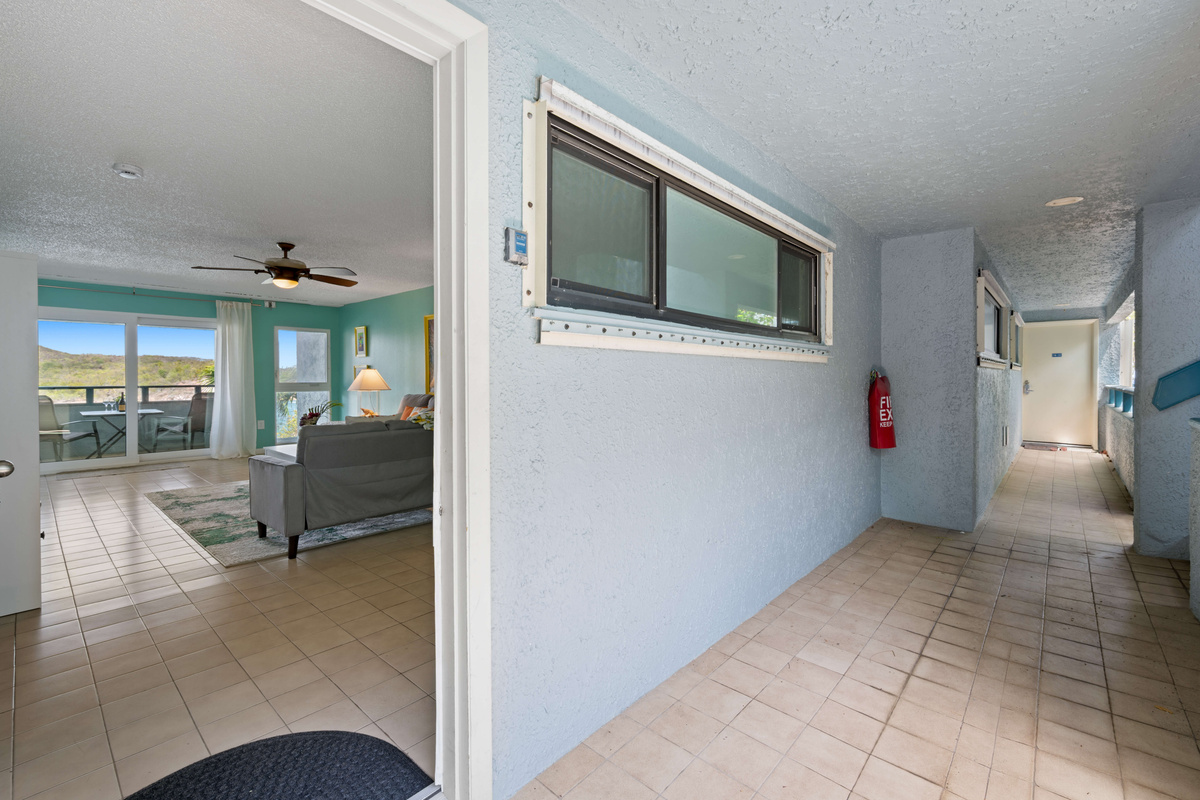 Quiet, well-maintained hallway leading to your island retreat.