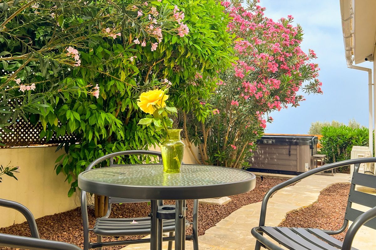 Seating group on the kitchen patio to enjoy a cup of coffee.