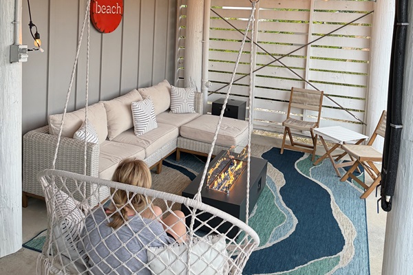 Relax with your family on cooler nights by the firepit on the patio.  You’ll sink into the wonderful sofa or enjoy snuggling into the hammock swing while the sounds of the nearby wetlands nature soothe you and your fresh catch cooks on the grill here!