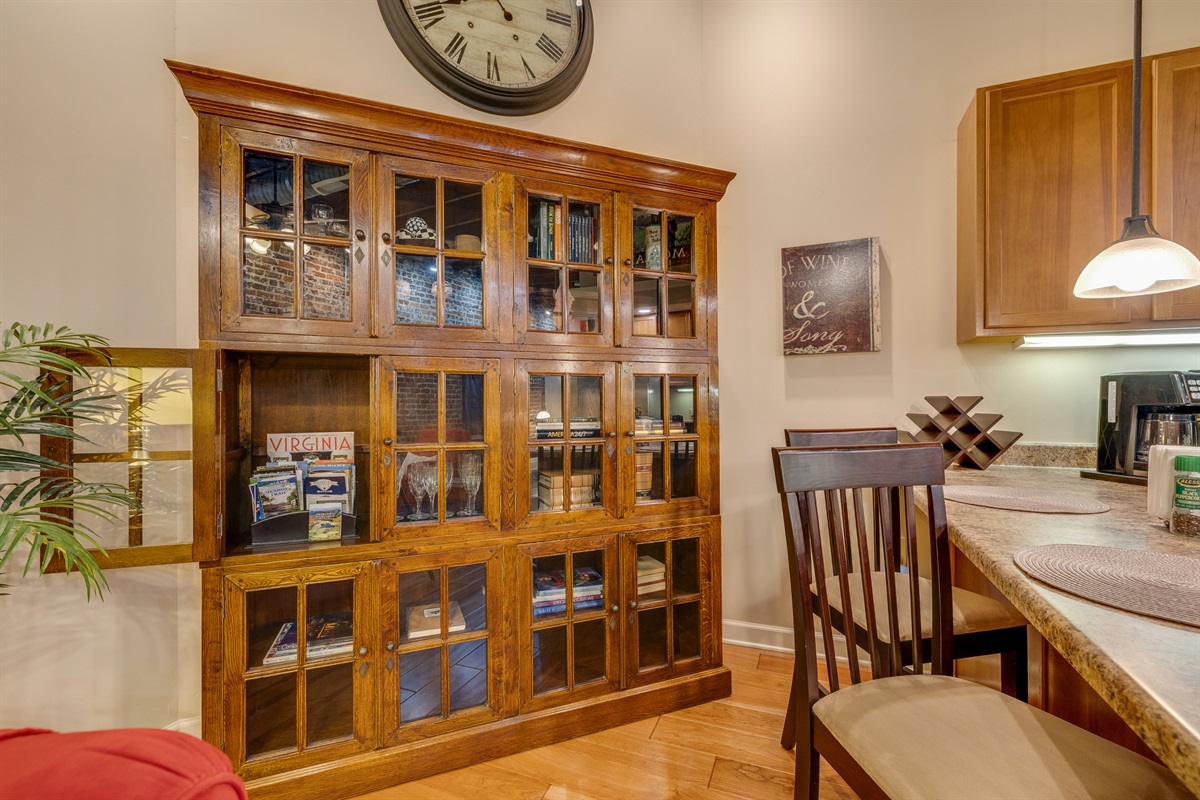 This unique piece of furniture is used to hold books, brochures of the area and additional kitchen serving pieces. 