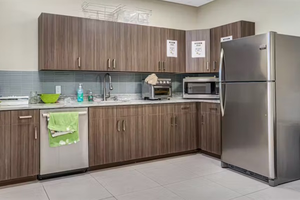 Well-Appointed Kitchenette: Whip up morning coffee or light snacks in our modern kitchenette, complete with full-size appliances and generous counter space for effortless entertaining.