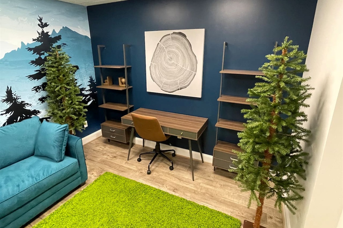 Remote work office with a vacation feel! Can also double as an extra bedroom- Reclining chair pulls out to a single bed.  Unique and cozy feel!