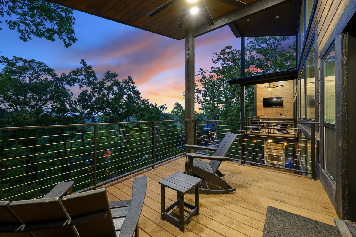Private upper-level deck off Bedroom 1, offering a peaceful spot for morning coffee and beautiful mountain views.
