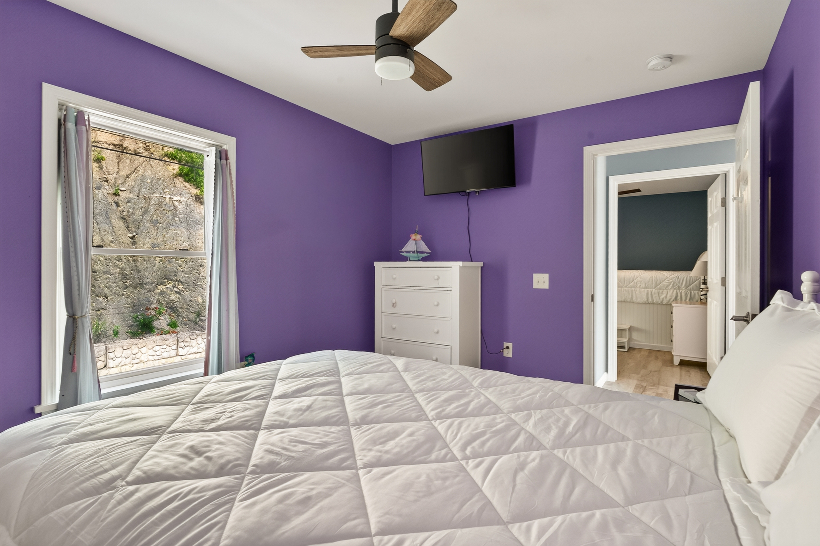 Bedroom window overlooking the rocky hillside