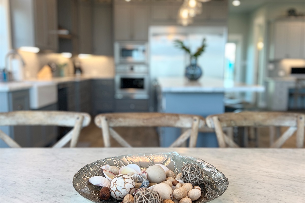 Crystal Paradise Kitchen: Bright, open kitchen featuring luxurious marble surfaces and generous space for gatherings.