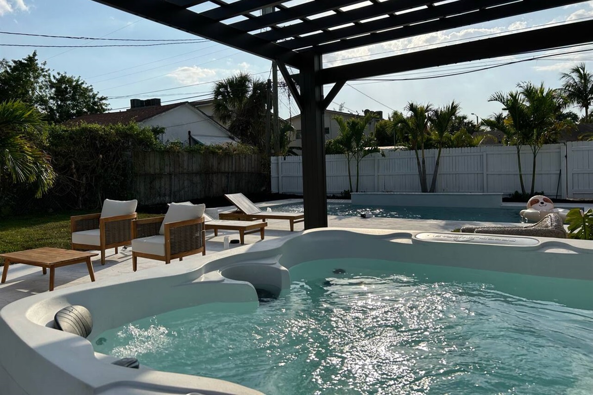 Completed in 2023, our oversized luxury pool comes with fountains, a waterfall and a unique, custom tropical mural on the back of the house. Enjoy this sliver of backyard paradise!