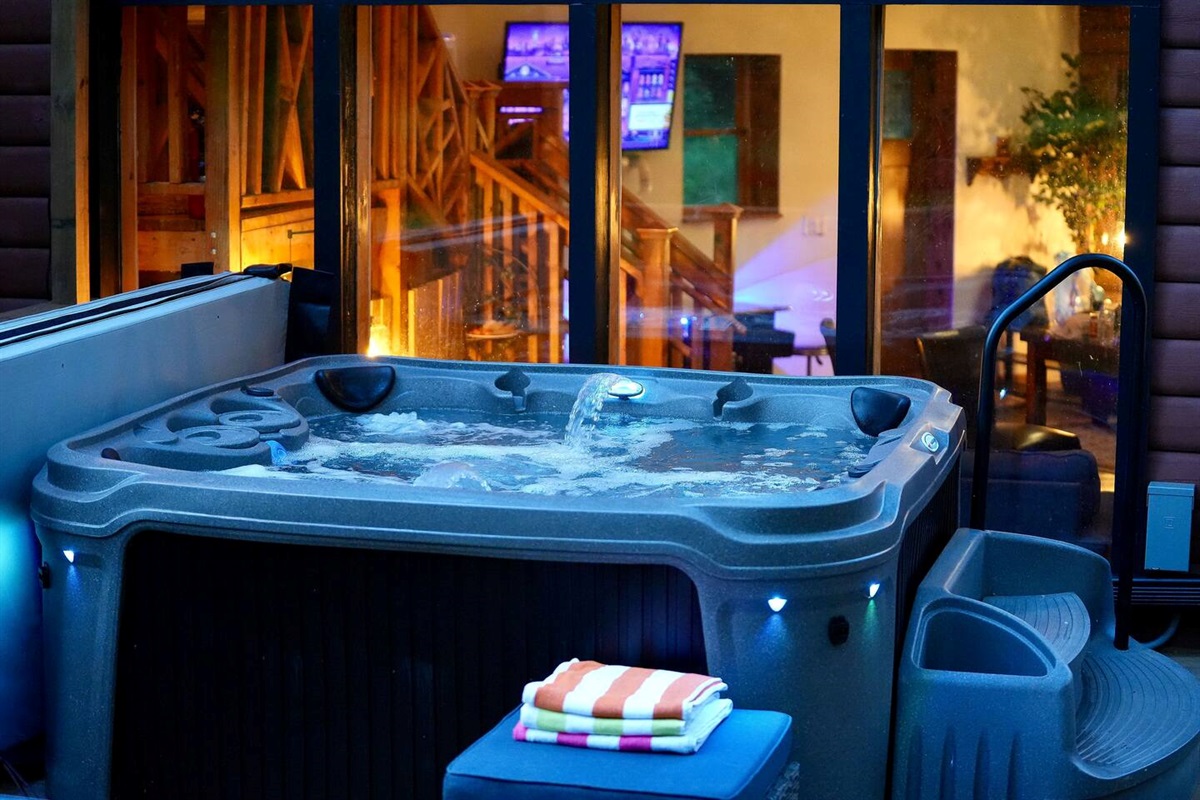 Hot tub is right outside the sunroom windows.